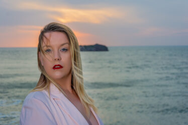 First-time model photographed outdoors at the Devon coast during an evening photoshoot